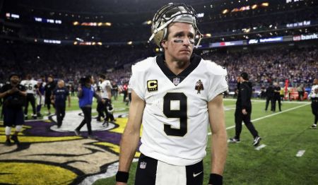 Drew Brees in his kit poses for a picture after the match.